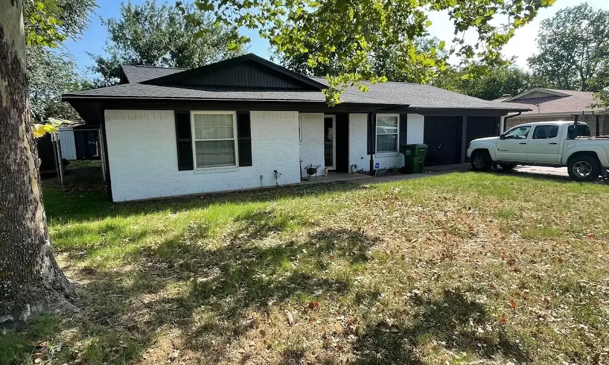 Professional roofing crew working on a residential roof in Weldon Spring